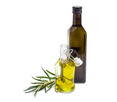 Two different glass bottles of the olive oil and olive branch beside on a white background
