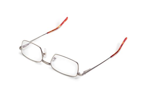 Modern pair of the classic mens eyeglasses in metal frame on a white background
