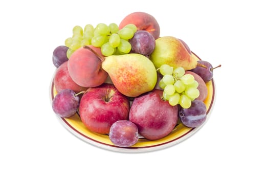 Several apples, pears, plums, peaches and clusters of white grapes on the big yellow dish on a white background
