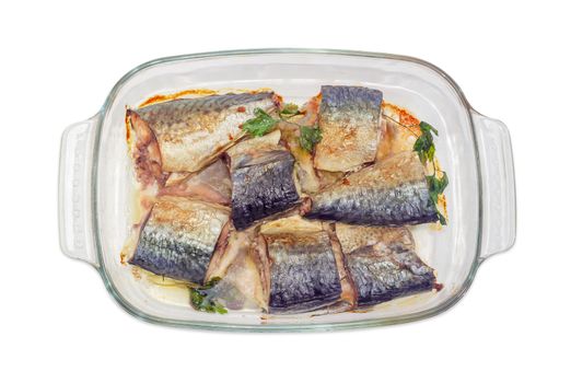 Top view of the rectangular glass pan for baking with baked pieces of Atlantic chub mackerel on a white background
