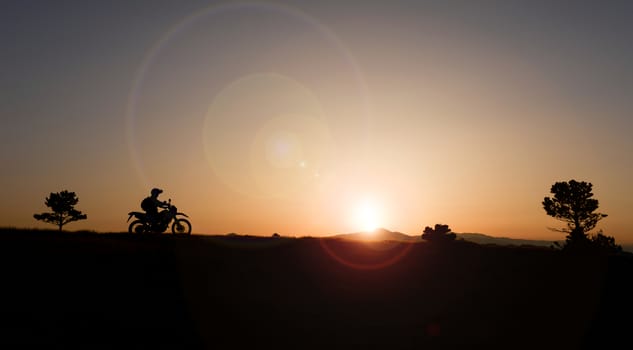 watching the sunrise at break motorcyclist