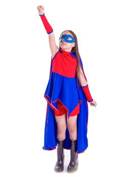Young female child in blue and red superhero outfit with arm extended in flying pose