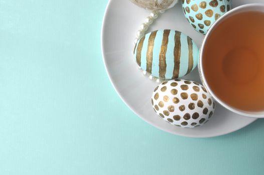 Teal mint turquoise aqua polka dots decorated Easter eggs with copy space