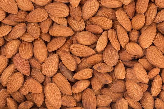 Peeled almonds closeup. For vegetarians, food background