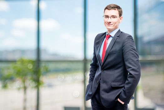 Successful businessman posing in office