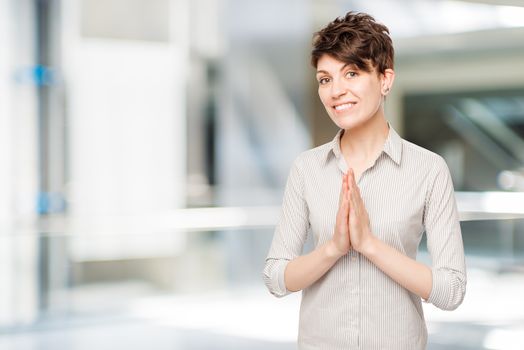 25-year-old brunette in a shirt posing in the office