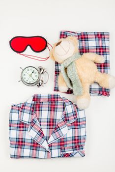 teddy bear and checkered warm pajamas set top view for sleeping