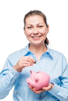 portrait of successful businesswoman with piggy bank and coin on white background