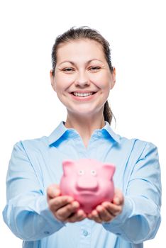 Happy woman holds a piggy bank full of money, photo on a white background