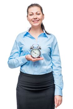 Successful businesswoman with an alarm clock in hands on a white background