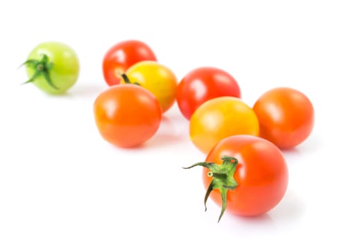 Fresh colorful cherry tomatoes on white background, raw food and vegetable concept