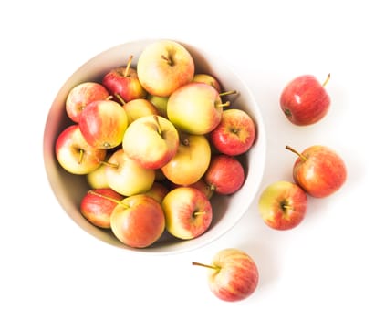 Closeup top view red apple on white bowl with white background, fruit healthy concept