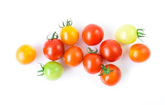 Fresh colorful cherry tomatoes on white background, raw food and vegetable concept