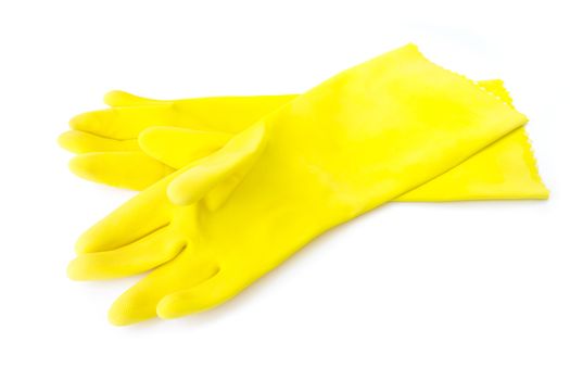 Yellow color rubber gloves for cleaning on white background, housework concept