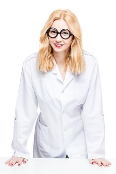 Portrait of a blond doctor with funny glasses on a white background