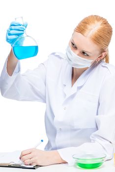 Doctor assistant examining substances in test tubes on white background