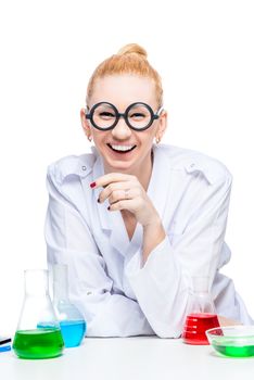 cheerful laughing assistant in glasses and a lab coat with test tubes