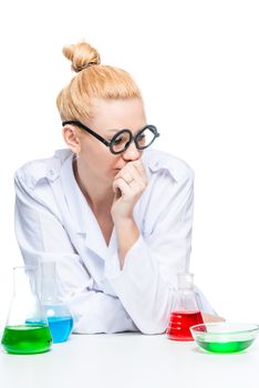 vertical portrait of a laboratory assistant in funny glasses with test tubes