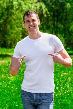 Man posing in the park on a sunny day