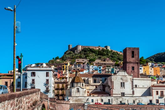 View of ancient village of Bosa on Temo river in a sunny morning of summer - Sardinia - Italy