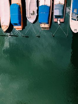 Beautiful boats. Aerial view of colorful boats in Stockholm, Sweden. Summer seascape with ships, sunny day. Top view, yachts from flying drone