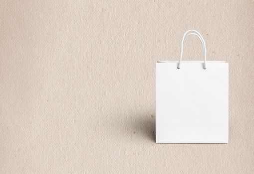 white paper bag for shopping on a light background
