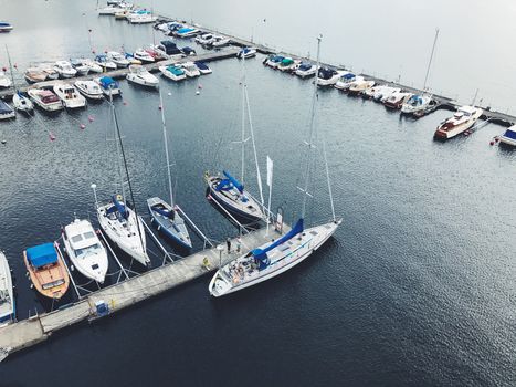 Beautiful boats. Aerial view of colorful boats in Stockholm, Sweden. Summer seascape with ships, sunny day. Top view, yachts from flying drone