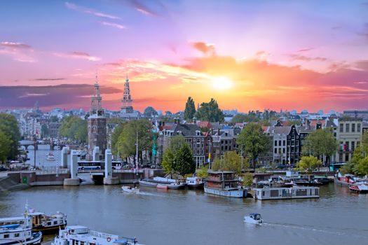 Aerial from the city Amsterdam in the Netherlands at sunset