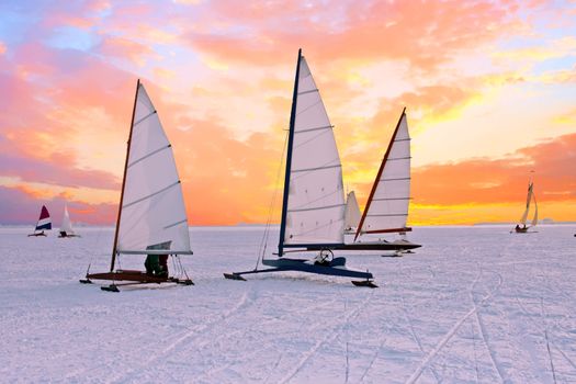Ice sailing on the Gouwzee in the countryside from the Netherlands at sunset