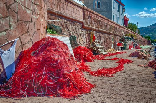 Closeup of fishing net in a harbor in a sunny morning of summer in hdr - Bosa - Sardinia - Italy