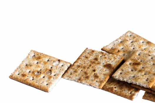 some whole wheat crackers on white background