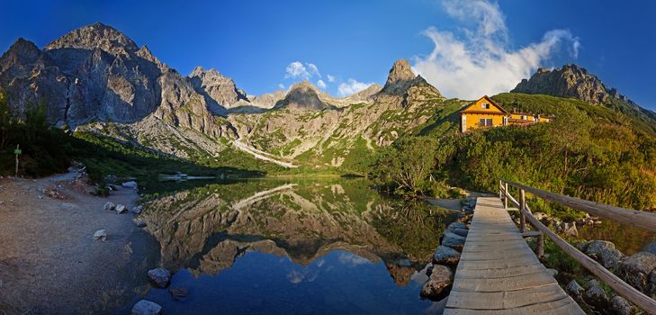 Alpine lake Zelene pleso in the morning with a great view on Tatra mountains.