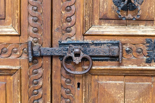 Close up of rustic old door in Assisi, Italy.