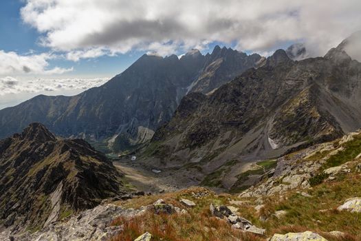 View on high Tatra Mountains with dramatic cloudy sky. View on green lake valle -Zelene pleso.