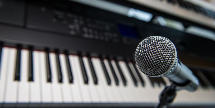 Studio room with synthesizer and microphone equipment, France