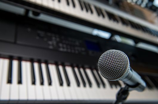 Studio room with synthesizer and microphone equipment, France