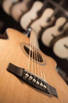 Many Classical Guitars Hanging on Wall in the Shop, France