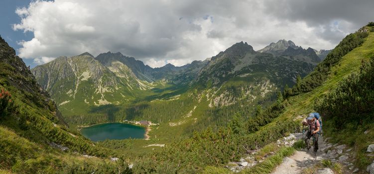 Alpine lake Popradske pleso in the morning with a great view on Tatra mountains.