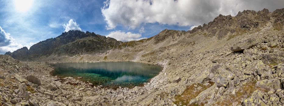 Alpine lake Velke Zabie pleso, with a great view on High Tatra mountains.
