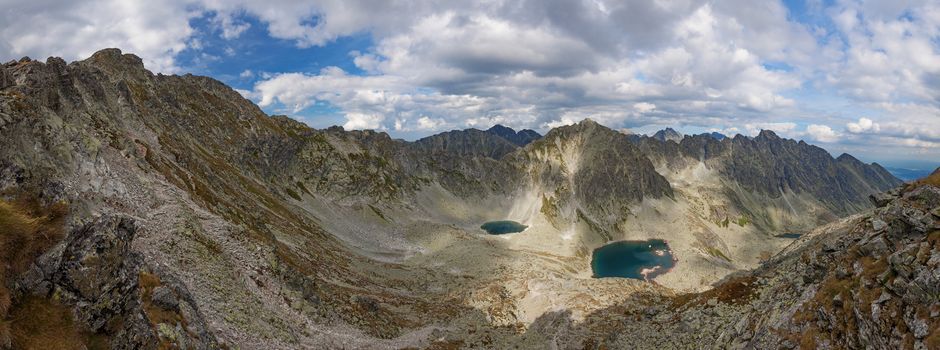 Alpine lake Vysne Wahlenbergovo pleso, with a great view on High Tatra mountains.