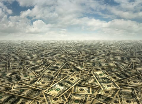 Background of fifty and one hundred dollar bills underneath a cloudy sky.