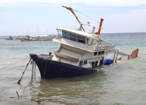 Sinking boat after a storm