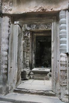 Window of the ancient temple in the complex of Angkor, near the ancient city of Siem Reap. 