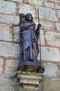 Representation of Jesus Christ and the Paschal lamb on the facade of the Saint Maurice church in Damvillers, France