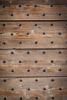 Detail of a 200 years old Italian door, made of wood.  Background use.