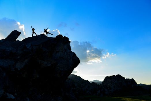 adventurers at the top of the rock