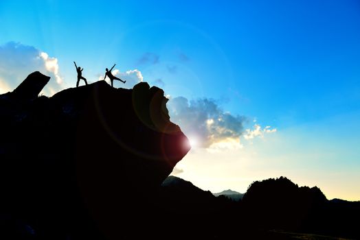 adventurers at the top of the rock