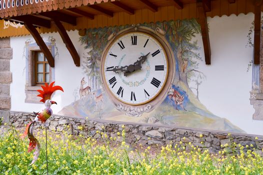 Clock on the facade of a house in Hofgut Sternen in the Black Forest in Germany