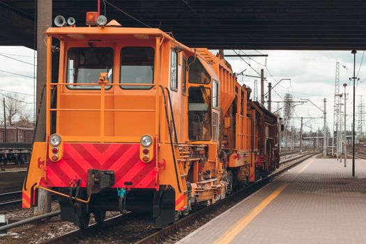 Ballast distributing and profiling track machine. Repair train