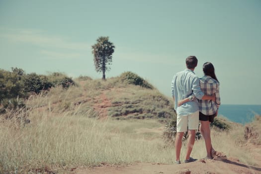 Young couple enjoy beautiful sea view on vacation